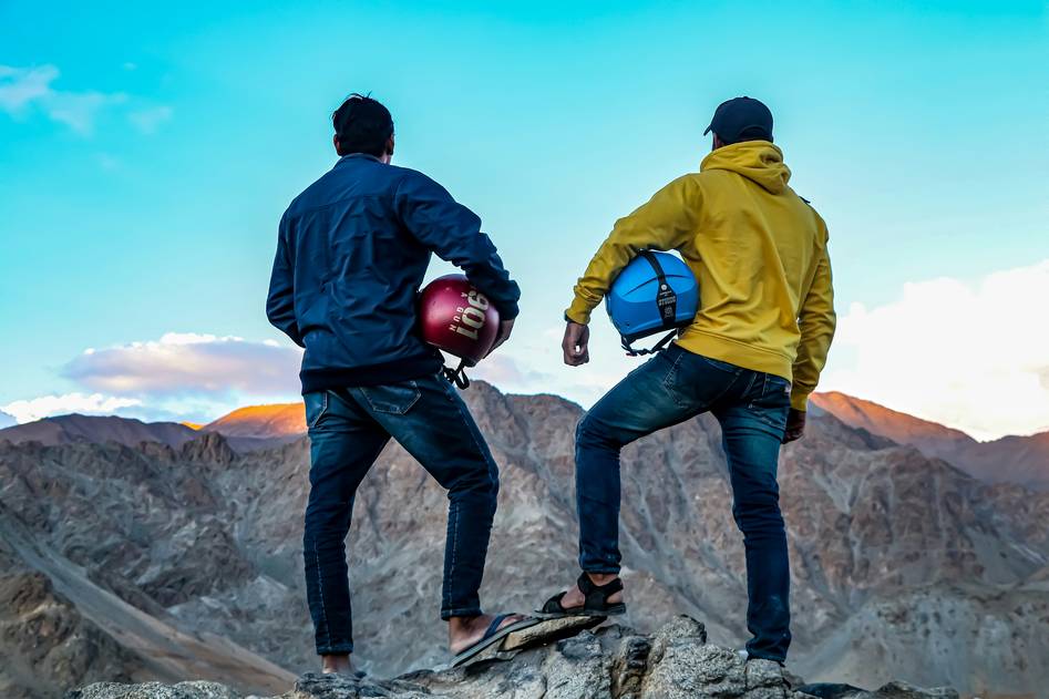 Climber wearing helmet on rugged trail