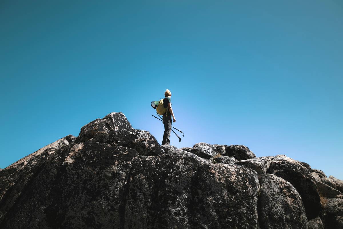 Climber testing Lightweight Helmet Models in alpine terrain