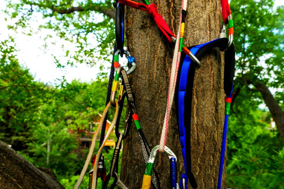 Comparison of basic mountain climbing gear laid out on granite slab